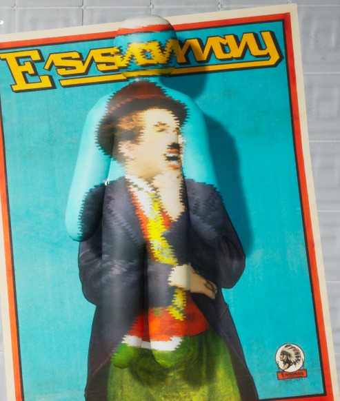 A character painted to match a vivid blue portrait poster